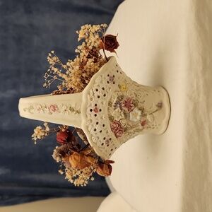 6" vase with delicate flowers on vase and handle.